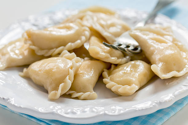 istock Dumplings with cottage cheese and fork on the plate. 486462826