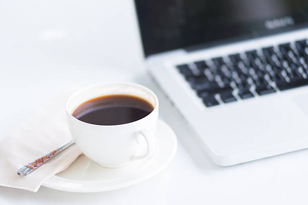 istock Coffee cup and laptop for business 486462916