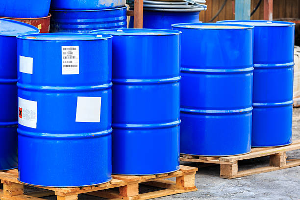 istock Big blue barrels on wooden pallets 486463074
