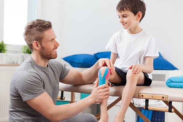 istock Kinesio taping after knee injury 486463650