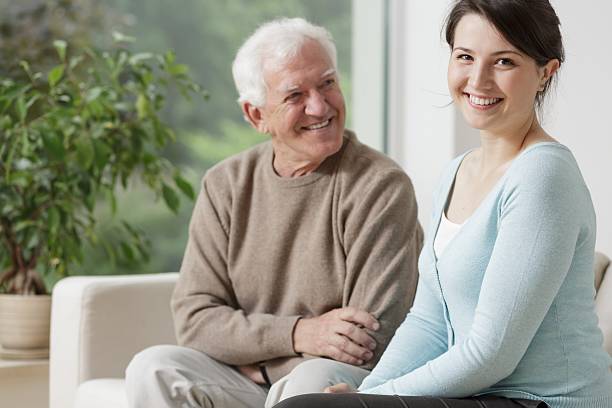 istock Smiling grandpa and caring granddaughter 486463652