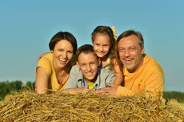 istock Happy family in wheat field 486463982
