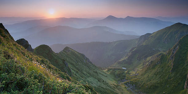 istock Sunrise above Carpathian mountain valley 486467172