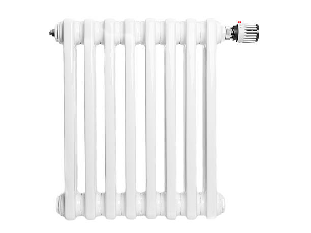 Home radiator isolated on white Close-up of home radiator with thermostat radiator heater stock pictures, royalty-free photos & images