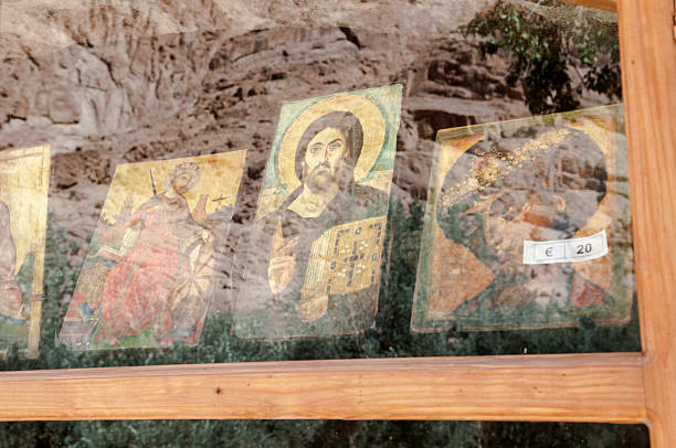 The barren mountains of Sinai are reflected in a gift shop window at St. Catherine's Monastery, built in the sixth century in the Sinai Peninsula, Egypt. Icons are on display in the window.