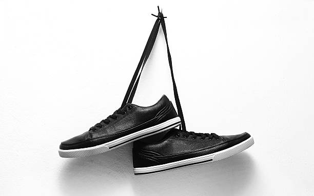 shoes hanging from laces