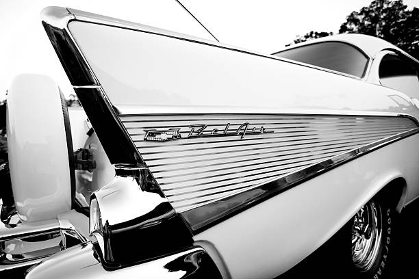 Nineteen fifty seven Chevy Bel Air, shot of rear, B&W Bear Mountain  New York, USA - August 26, 2015: Nineteen fifty seven Chevy Bel Air parked  at the "Car Cruse Rally" held every Wednesday in the summer months at Bear Mountain Park New York State. car classic light tail stock pictures, royalty-free photos & images