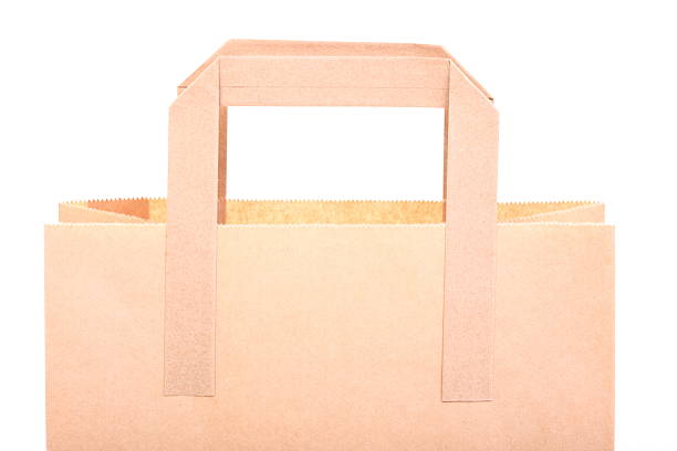 istock Shopping brown gift bags isolated 486472226