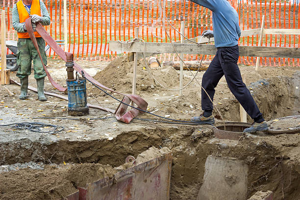 istock Workers With Industrial Submersible Water Pump 486472915