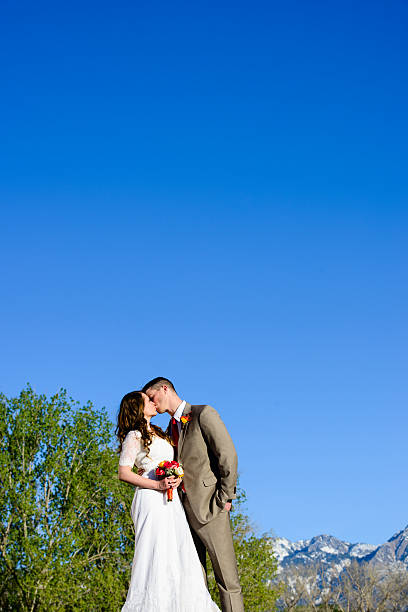 istock Wedding Couple Kiss 486473037
