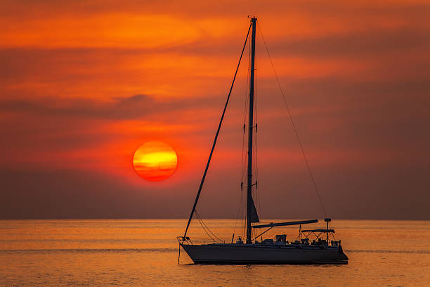 istock Yacht in the sea at sunset 486473215