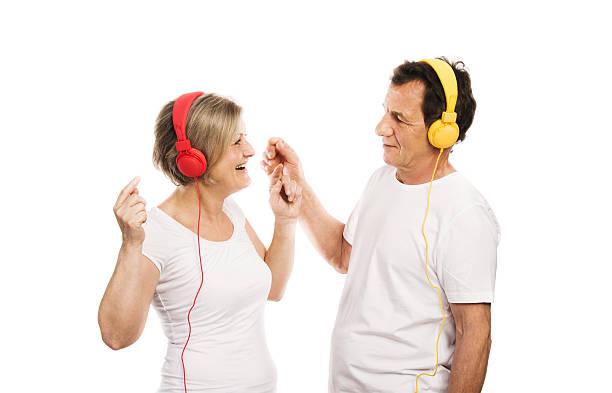 istock Senior couple with headphones 486473921