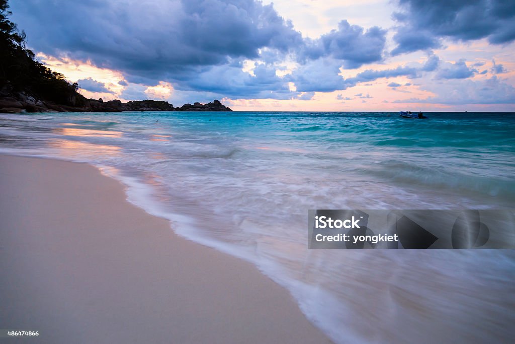 Beach and sea sunset at Koh Miang Thailand Beautiful beach and sea waves at sunset in summer on Koh Miang island, Mu Koh Similan National Park, Phang Nga Province, Thailand. 2015 Stock Photo