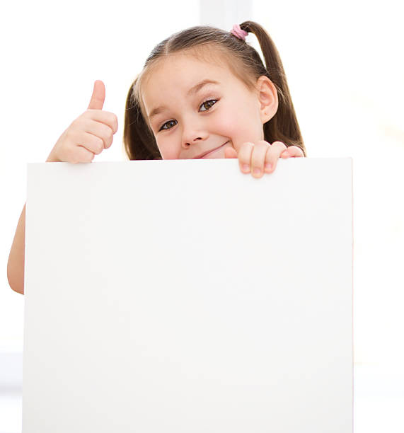 istock Cute girl is holding blank banner 486475375