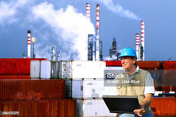 Engineer In Chemical Plant Stock Photo - Download Image Now - Laptop, Chimney, Industry