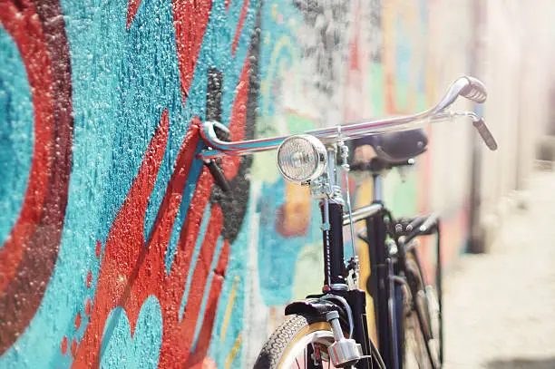 Photo of Vintage style bicycle leaning against wall