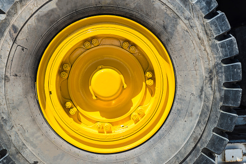 Yellow wheel of a big truck load