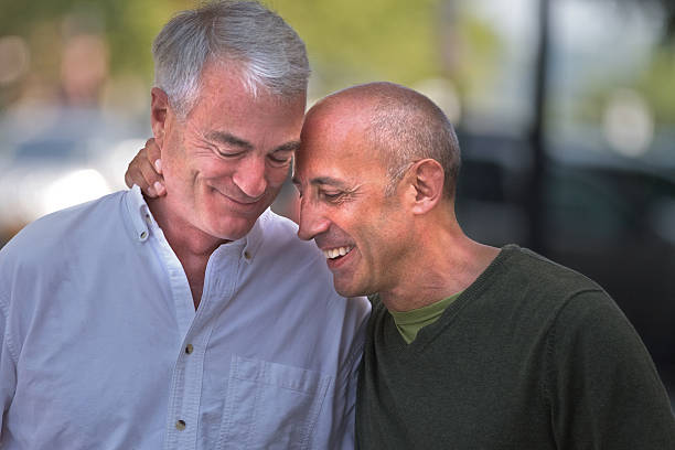 Senior Gay Male Couple Affectionate, Loving and Thoughtful Together stock photo