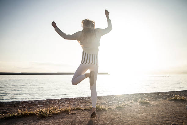 istock Happy jumping woman. 486484376