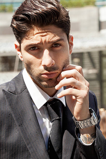 istock Handsome businessman in the city looking at camera 486485766
