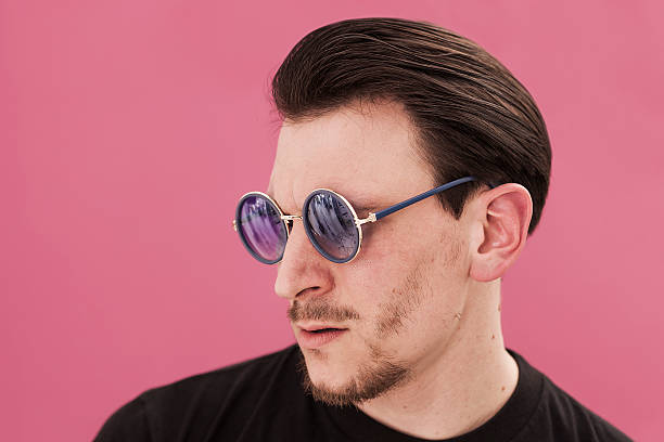 istock Handsome man portrait looking aside while wearing sunglasses 486485866