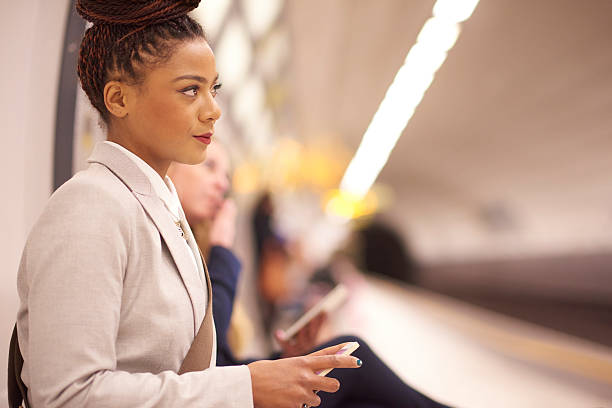 istock female commuter waits for subway train 486486030
