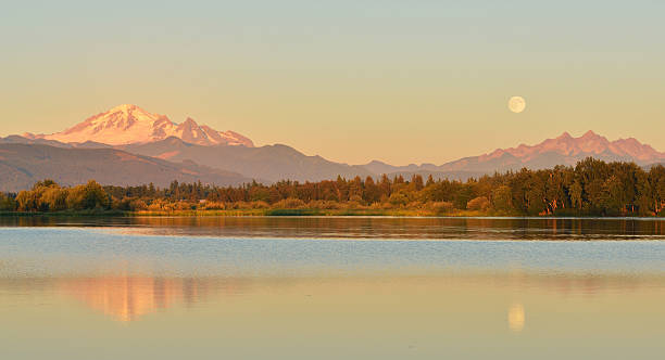 istock Full Blue Moon over Mt. Baker and Three Sisters Mountain 486489838