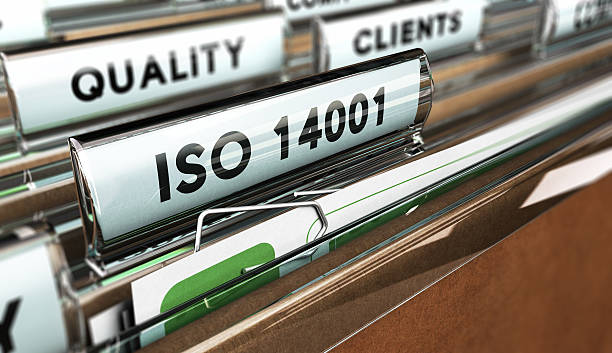 Quality Standards, ISO 14001. Close up on a file tab with the word ISO 14001, focus on the main text and blur effect. Concept image for illustration of Quality Standards 2015 stock pictures, royalty-free photos & images