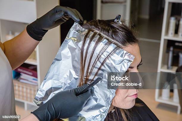 Hairdresser Hands Separating Woman Hair With Aluminium Foil Stock Photo - Download Image Now