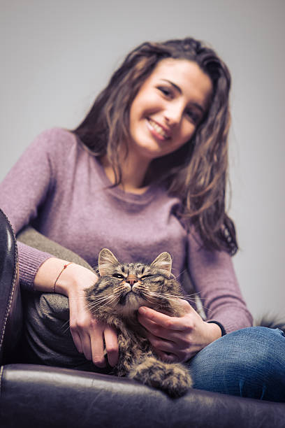 istock Young woman cuddling a cat 486492162
