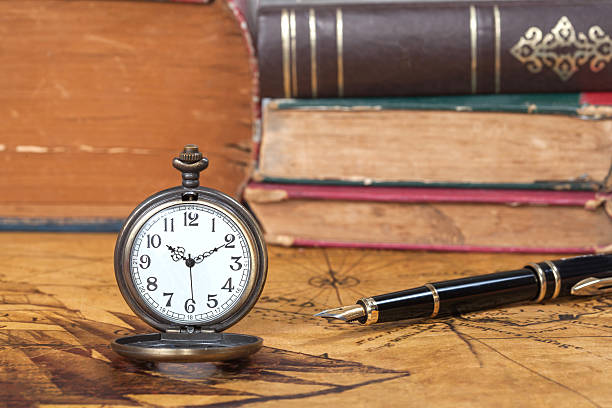 istock Vintage pocket watch on old map background 486495646
