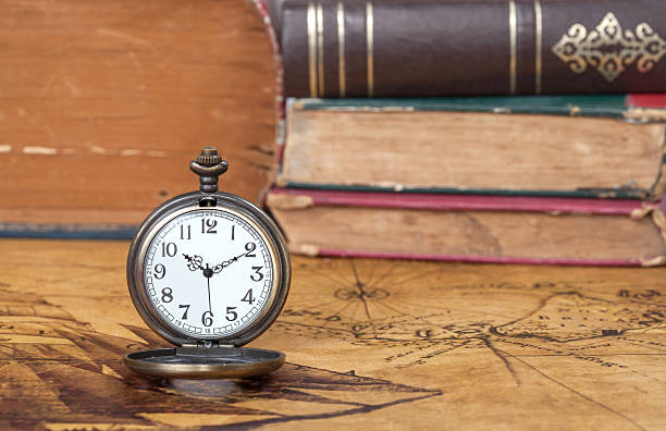 istock Vintage pocket watch on old map background 486495690
