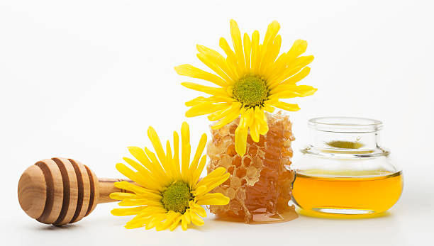 istock Fresh honey in a jar and honey dipper 486495910