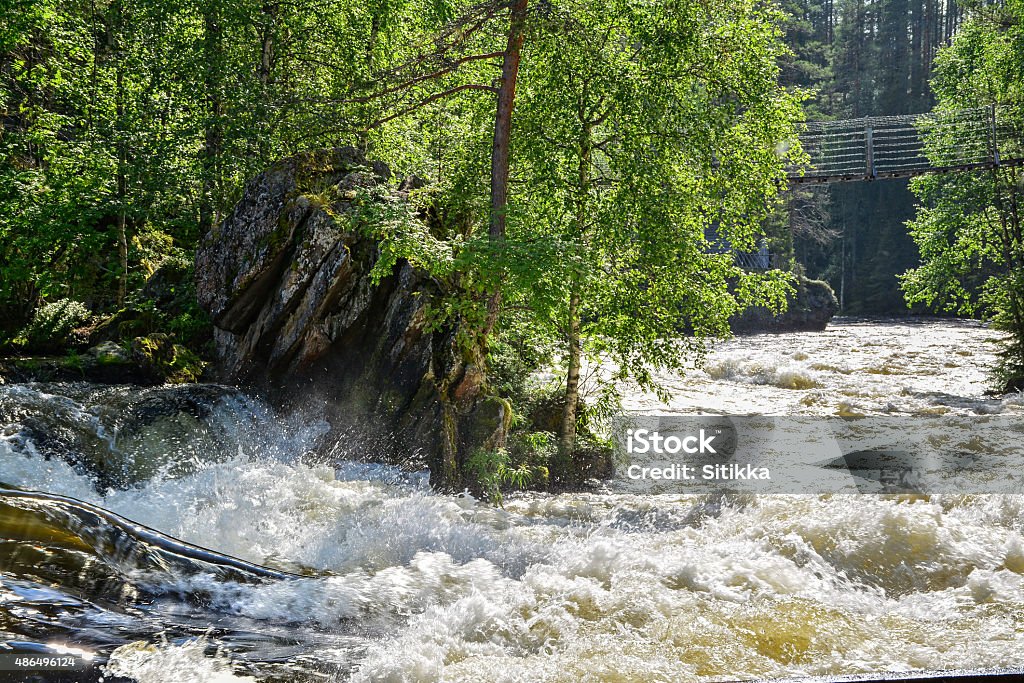 River and hanging bridge River rapid and hanging bridge over river 2015 Stock Photo