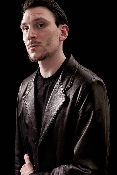 istock Male portrait wearing leather coat and looking 486498586