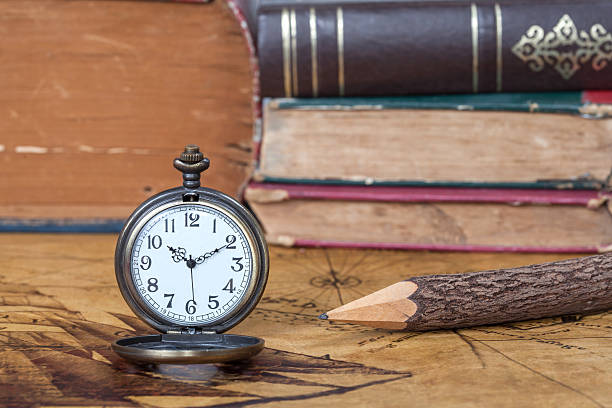 istock Vintage pocket watch on old map background 486499754