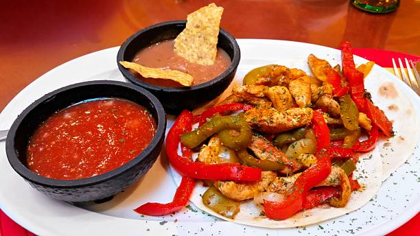 istock Chicken fajitas with salsa and beans 486500504