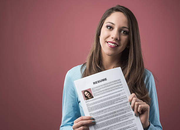 istock Young woman holding her resume 486500946