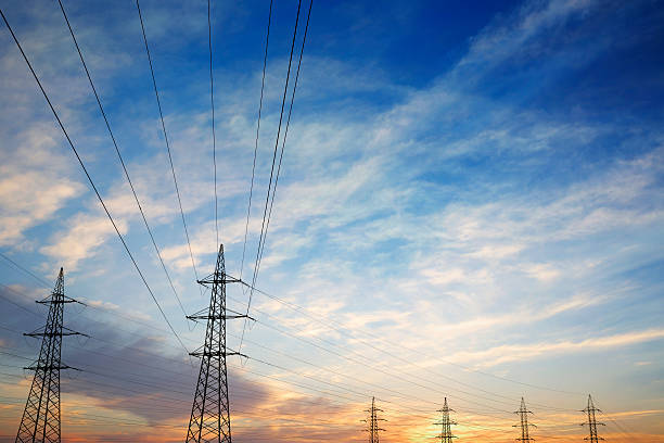 istock Pylons and power lines at sunset with vibrant sky 486501845