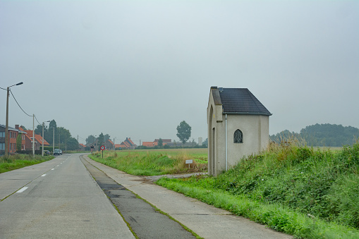 Small street  on the French Belgium border on a wet overcast day, former wold war 1 area