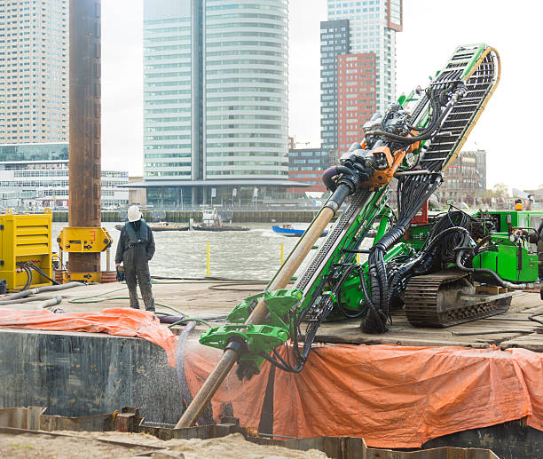 Horizontal directional drilling (HDD)  machinery working in Rotterdam. Working HDD (Horizontal directional drilling) machine used to lie underground pipes from above ground. construction skyscraper machine industry stock pictures, royalty-free photos & images