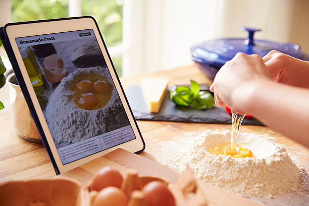 istock Person Following Pasta Recipe Using App On Digital Tablet 486506076