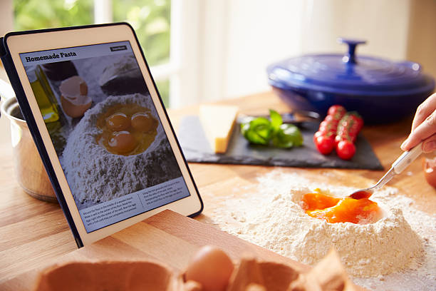 istock Person Following Pasta Recipe Using App On Digital Tablet 486506092