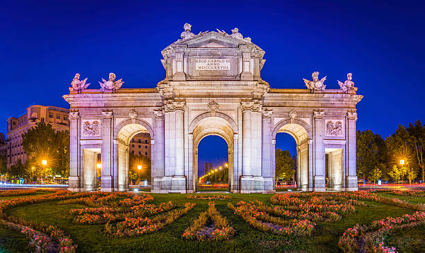 Madrid Puerta de Alcala iconic monumental gate illuminated dusk Spain