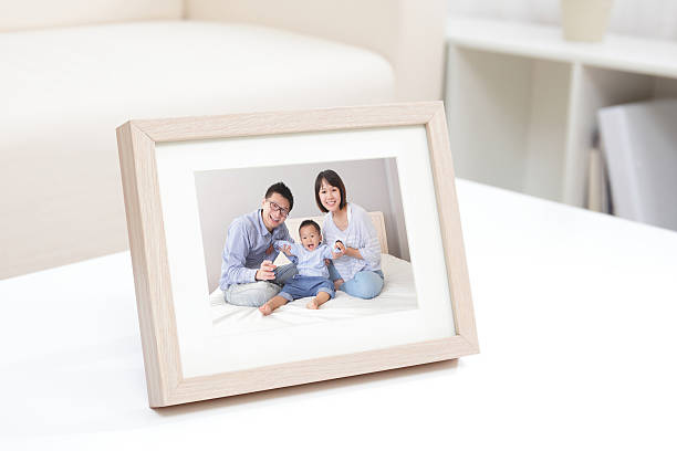 Happy Family photo Happy Family photo on white bookshelf at home family photo on wall stock pictures, royalty-free photos & images