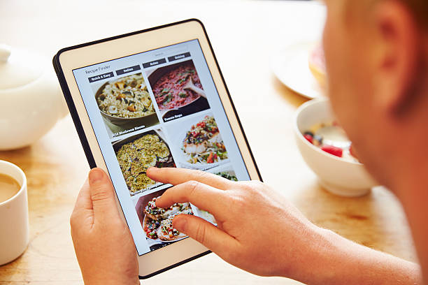 istock Person At Breakfast Looking At Recipe App On Digital Tablet 486507682