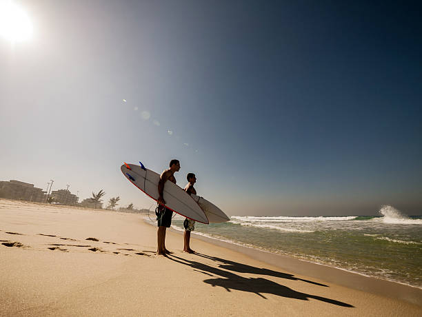 istock Latin American surfers looking at waves. Copy space. 486507820
