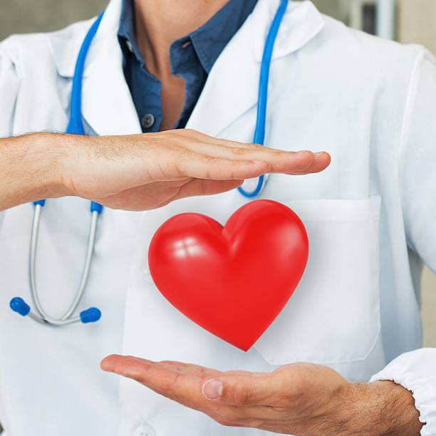 istock Doctor holding an Heart in His Hands 486508440