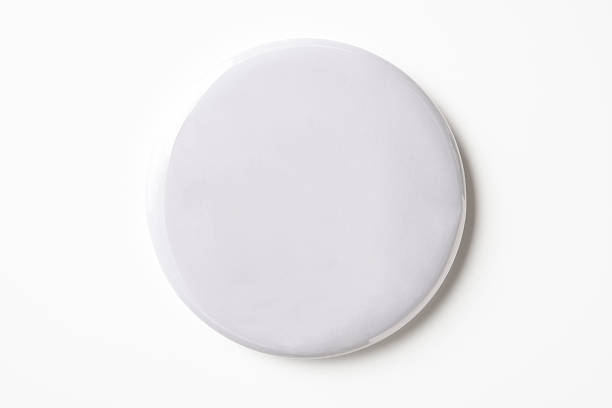 Isolated shot of blank white badge on white background Overhead shot of blank white badge isolated on white background with clipping path. badge photos stock pictures, royalty-free photos & images