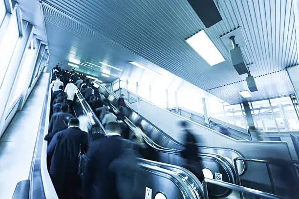 Photo of City Commuters on Escalator in the Morning